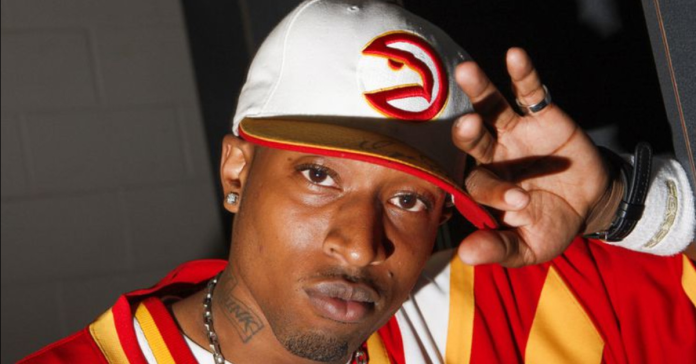Atlanta rapper DJ Unk wearing Hawks outfit