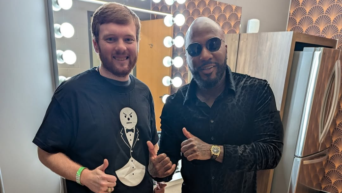 Rapper Jeezy with Uber driver who helped him reach show