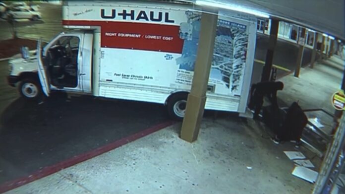 Surveillance video shows suspects using a U-Haul truck to steal an ATM from a laundromat in Mableton, Cobb County