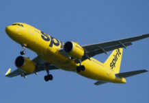 Spirit Airlines plane flying in the sky