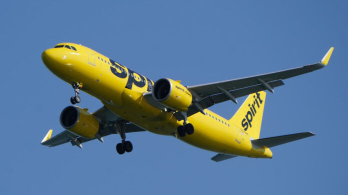 Spirit Airlines plane flying in the sky
