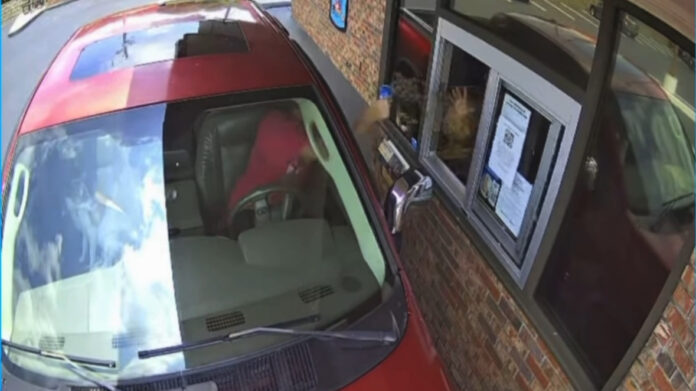 Customer throws a milkshake at a Dairy Queen manager through the drive-thru window in Powder Springs